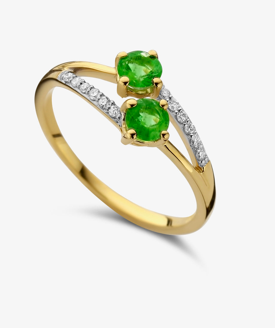 Bague en or jaune avec 2 émeraudes et des diamants-